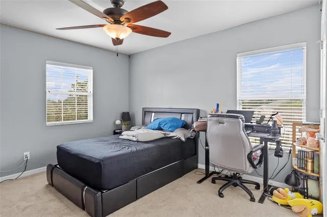 an aerial view of residential houses with outdoor space and swimming pool