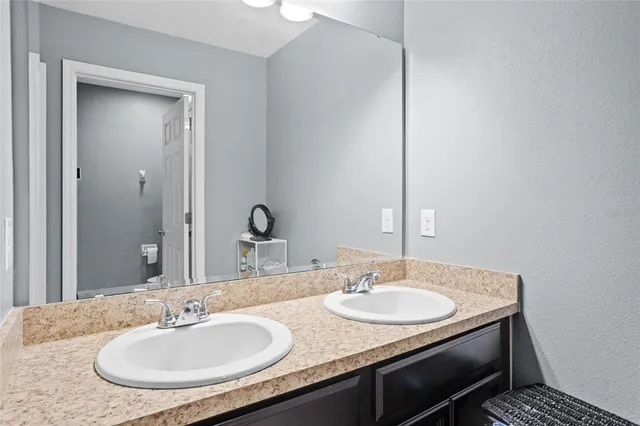 an aerial view of residential houses with outdoor space and swimming pool