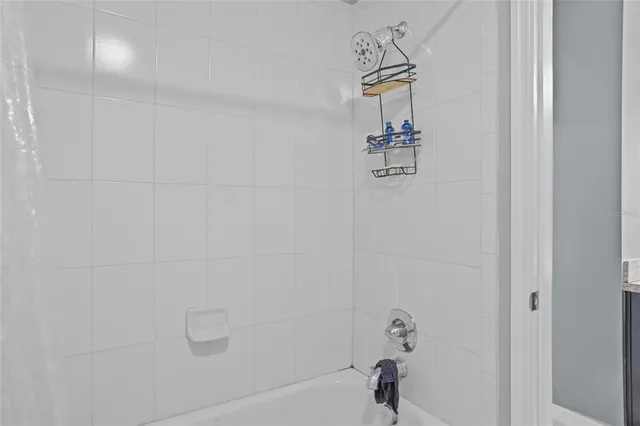 an aerial view of residential houses with outdoor space and swimming pool