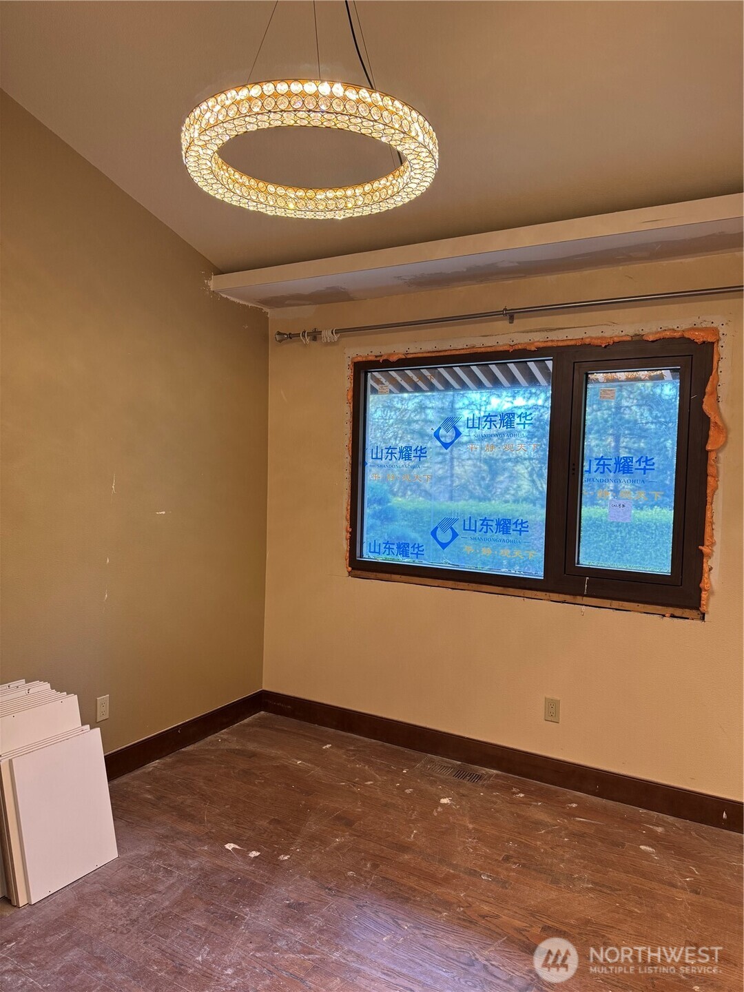2620 Maltby Road Bothell, WA 98012 - Photo 15 of 39 a view of a room with a wooden floor and a painting on the wall