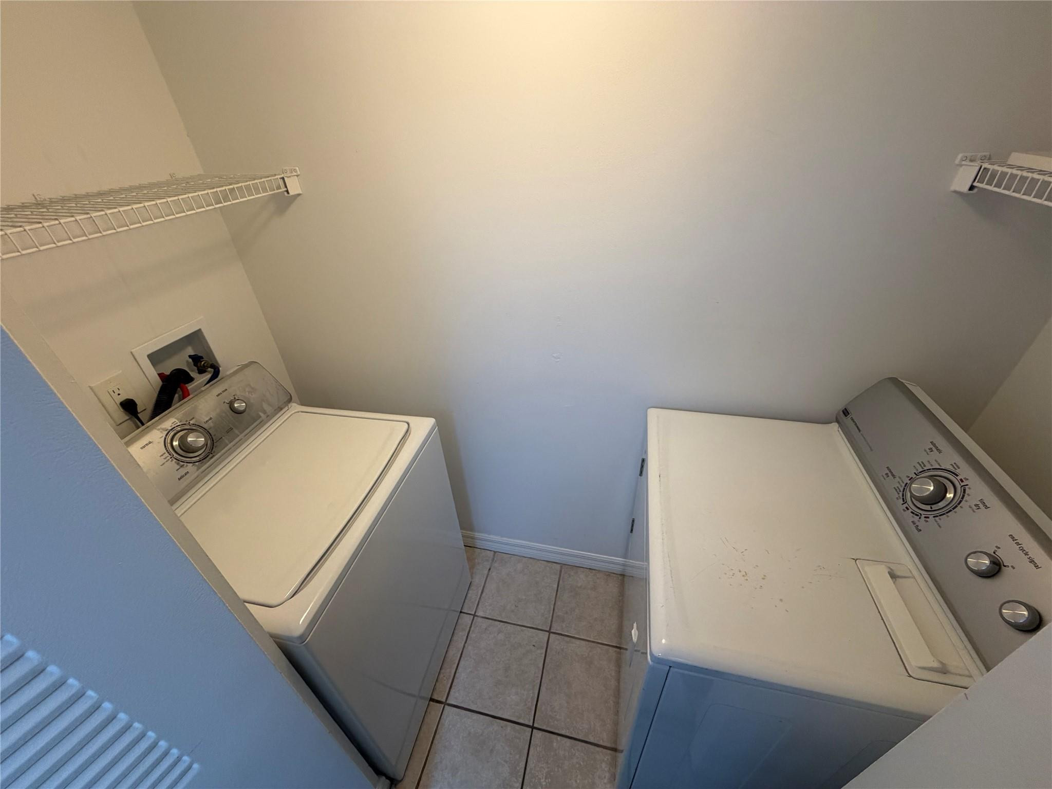 5005 Wiles Road, Unit 307 Pompano Beach, FL 33073 - Photo 23 of 28 a utility room with dryer and washer