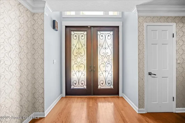 a large kitchen with a sink and cabinets