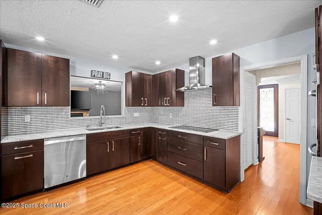 a kitchen with stainless steel appliances a refrigerator and a sink