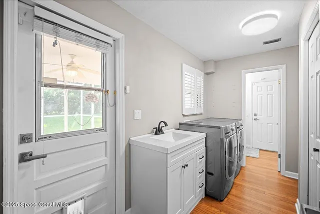 a bathroom with a granite countertop sink mirror and shower