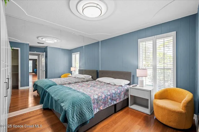 a bathroom with a granite countertop sink toilet a mirror a vanity and shower