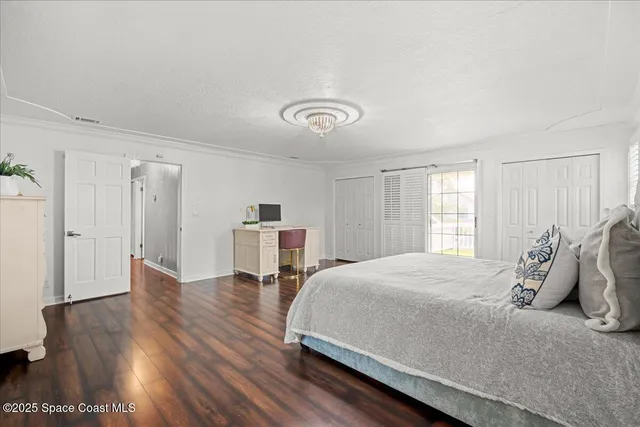 a bathroom with a granite countertop sink mirror and toilet