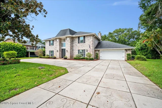 a view of a livingroom with furniture window and wooden floor
