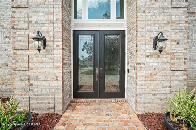 a kitchen with stainless steel appliances granite countertop a refrigerator and wooden cabinets