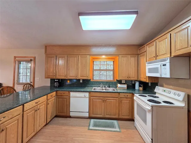 a view of a bathroom with wooden floor and bathroom