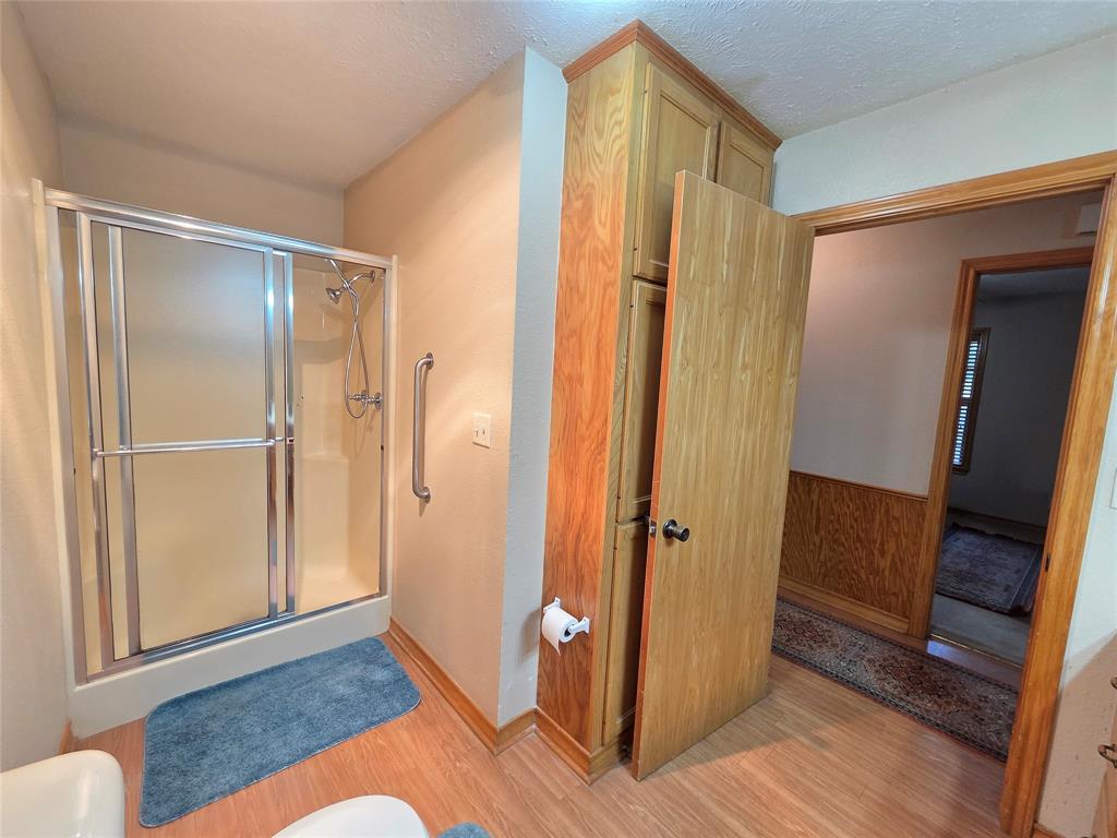 5015 561st Road Simms, TX 75574 - Photo 16 of 33 a view of a bathroom with wooden floor and bathroom