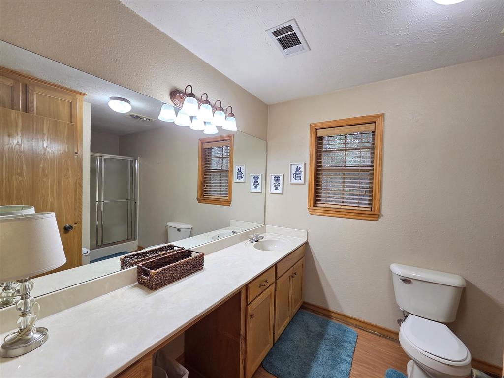 5015 561st Road Simms, TX 75574 - Photo 17 of 33 a bathroom with a sink a vanity and a mirror