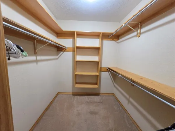 a view of an empty walk in closet