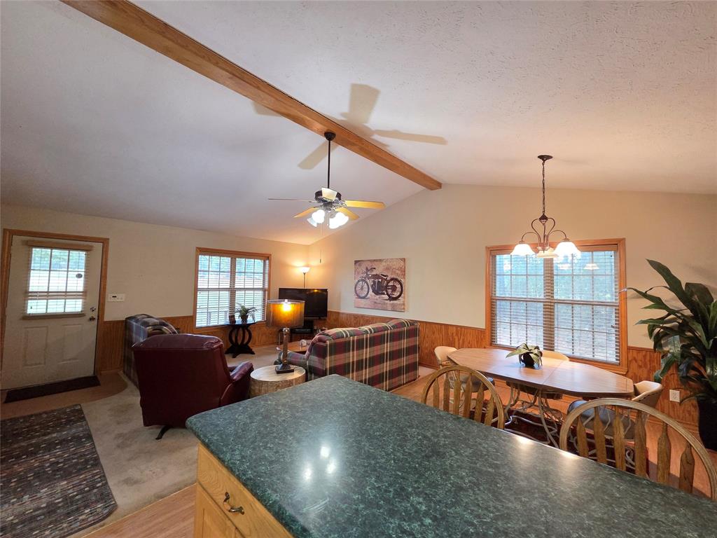 5015 561st Road Simms, TX 75574 - Photo 7 of 33 a living room with furniture and a chandelier