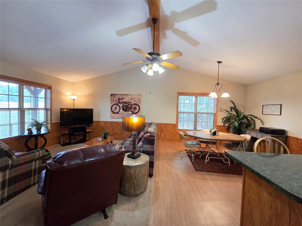 5015 561st Road Simms, TX 75574 - Photo 8 of 33 a living room with furniture a chandelier fan and a window