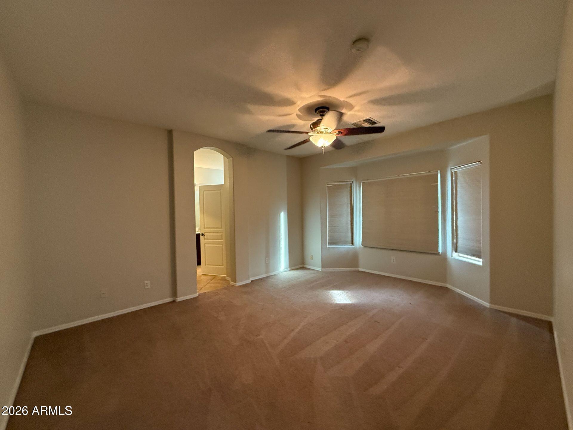 14641 West Hearn Road Surprise, AZ 85379 - Photo 16 of 42 a view of a livingroom with a ceiling fan and window