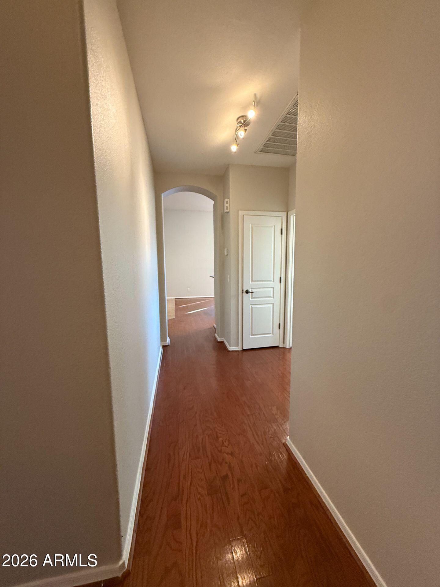 14641 West Hearn Road Surprise, AZ 85379 - Photo 26 of 42 a view of a hallway with wooden floor
