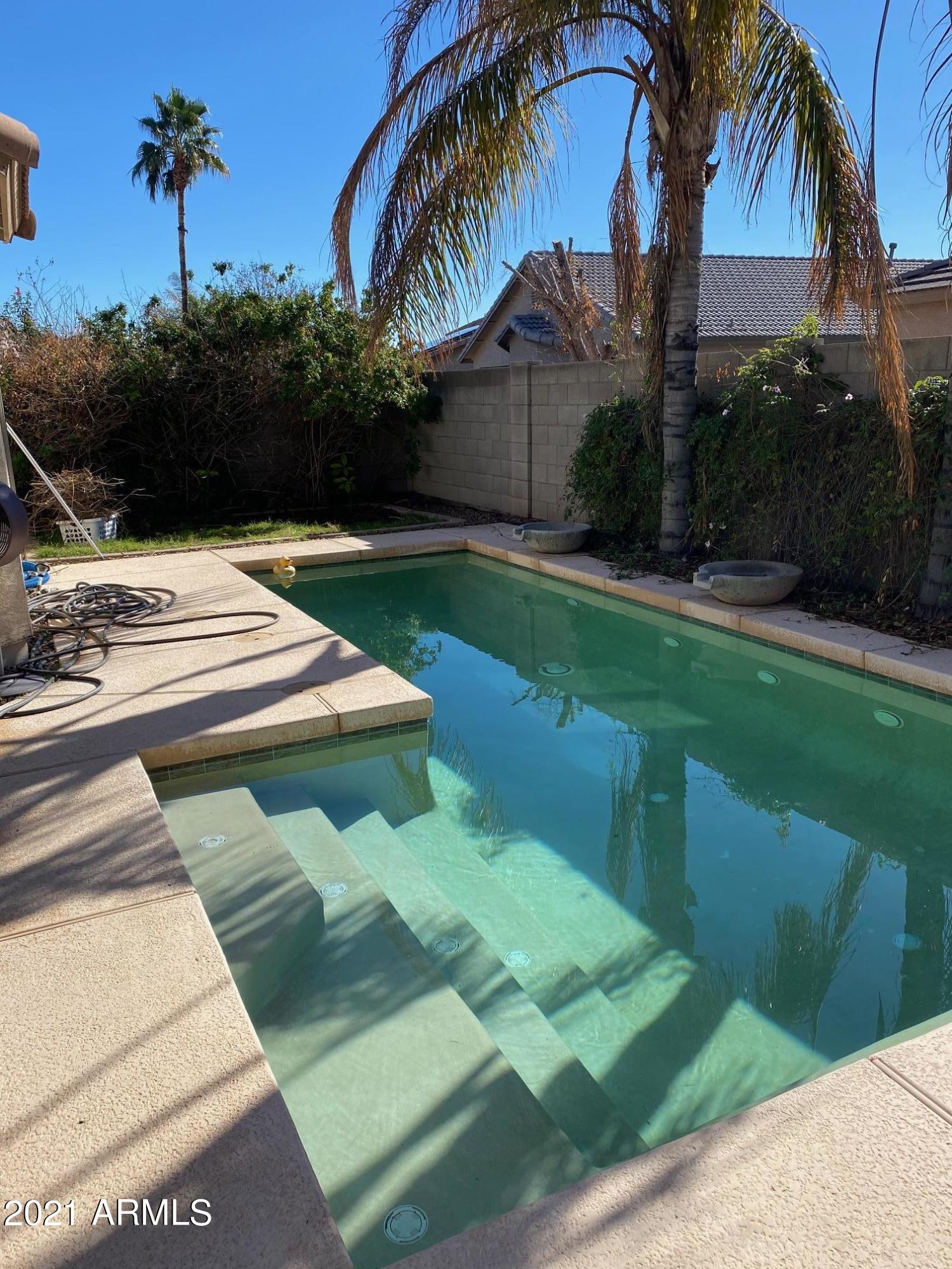 14641 West Hearn Road Surprise, AZ 85379 - Photo 28 of 42 a view of a backyard with a garden