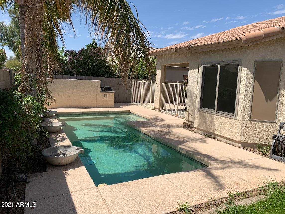 14641 West Hearn Road Surprise, AZ 85379 - Photo 30 of 42 a backyard of a house with seating space
