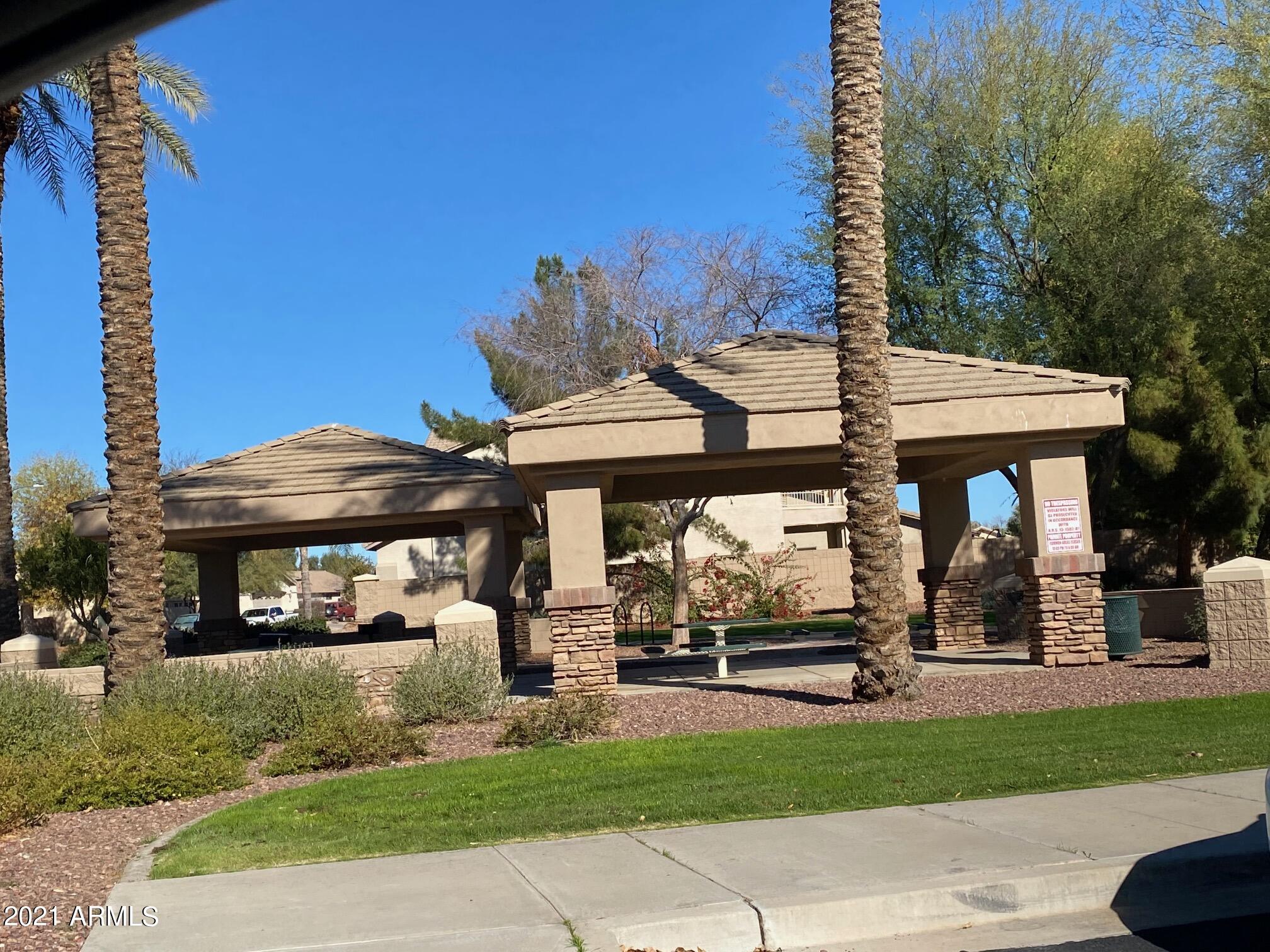 14641 West Hearn Road Surprise, AZ 85379 - Photo 41 of 42 a view of a car park in front of a house