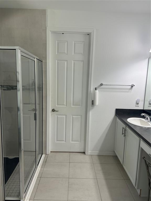 377 Vestrella Drive Kissimmee, FL 34759 - Photo 8 of 12 a bathroom with a granite countertop sink and shower