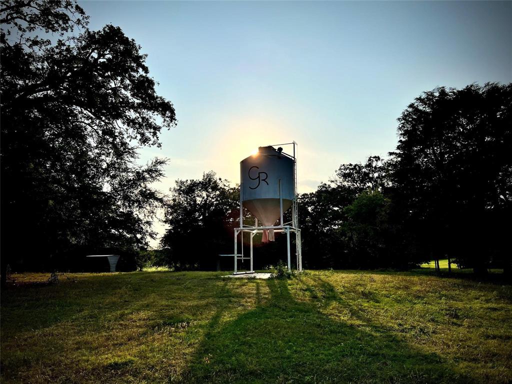 316 N North Eustace, TX 75124 - Photo 2 of 3 a man standing on a lush green field