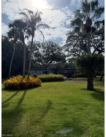 a view of backyard with green space