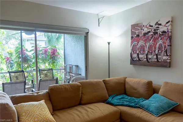 a living room with furniture and a window