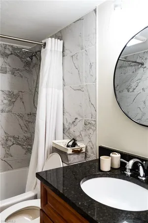 a bedroom with a bed and a lamp on table