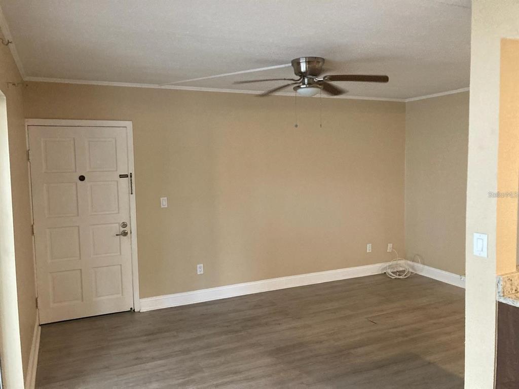 4611 West North B Street, Unit 220 Tampa, FL 33609 - Photo 10 of 11 a view of a room with wooden floor
