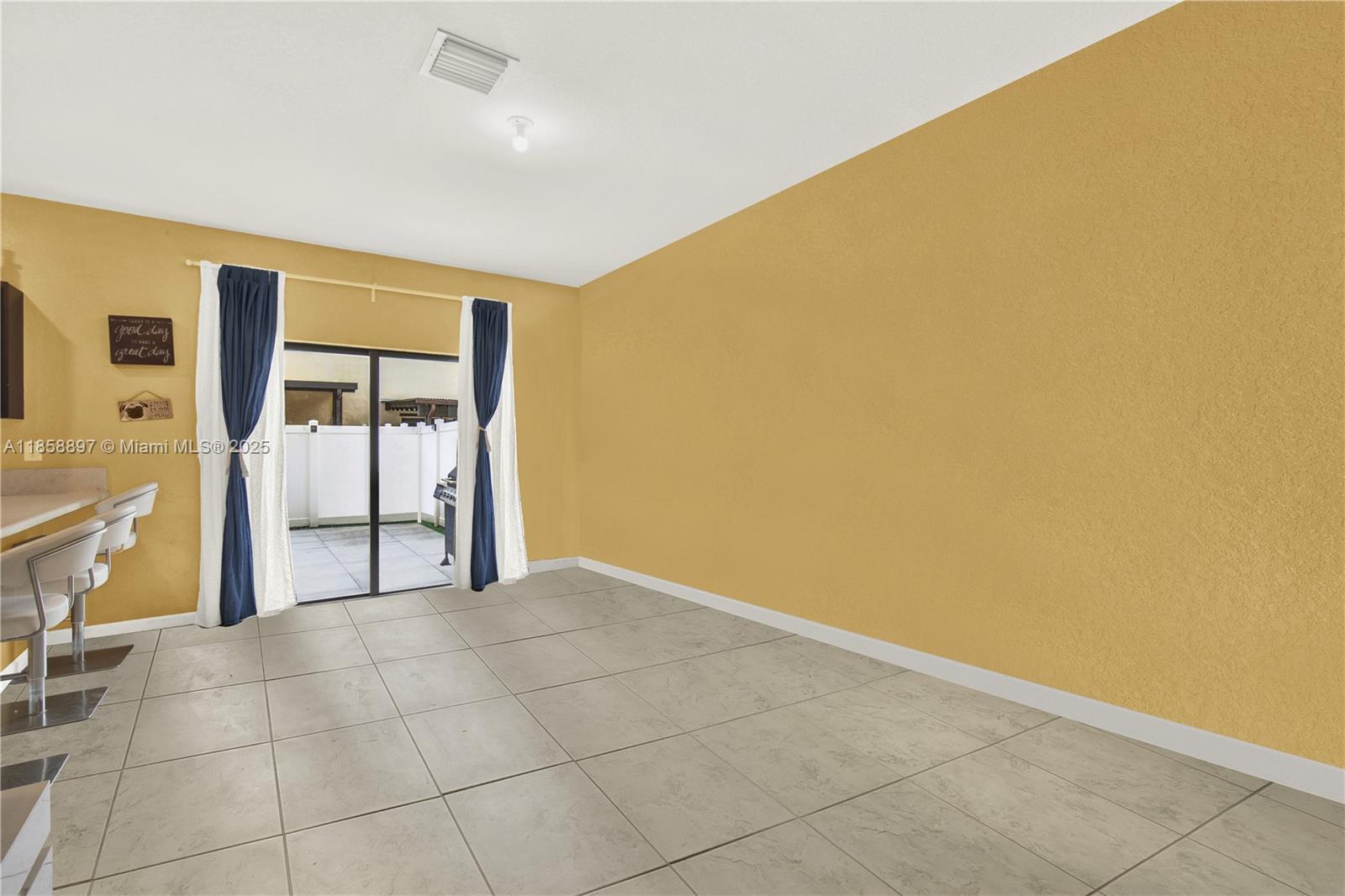 10480 West 33rd Lane Hialeah, FL 33018 - Photo 12 of 53 a view of an empty room with a window