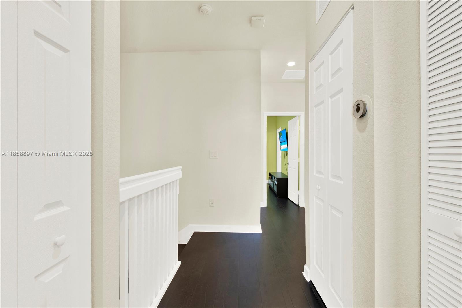 10480 West 33rd Lane Hialeah, FL 33018 - Photo 18 of 53 a view of a hallway with wooden floor and staircase