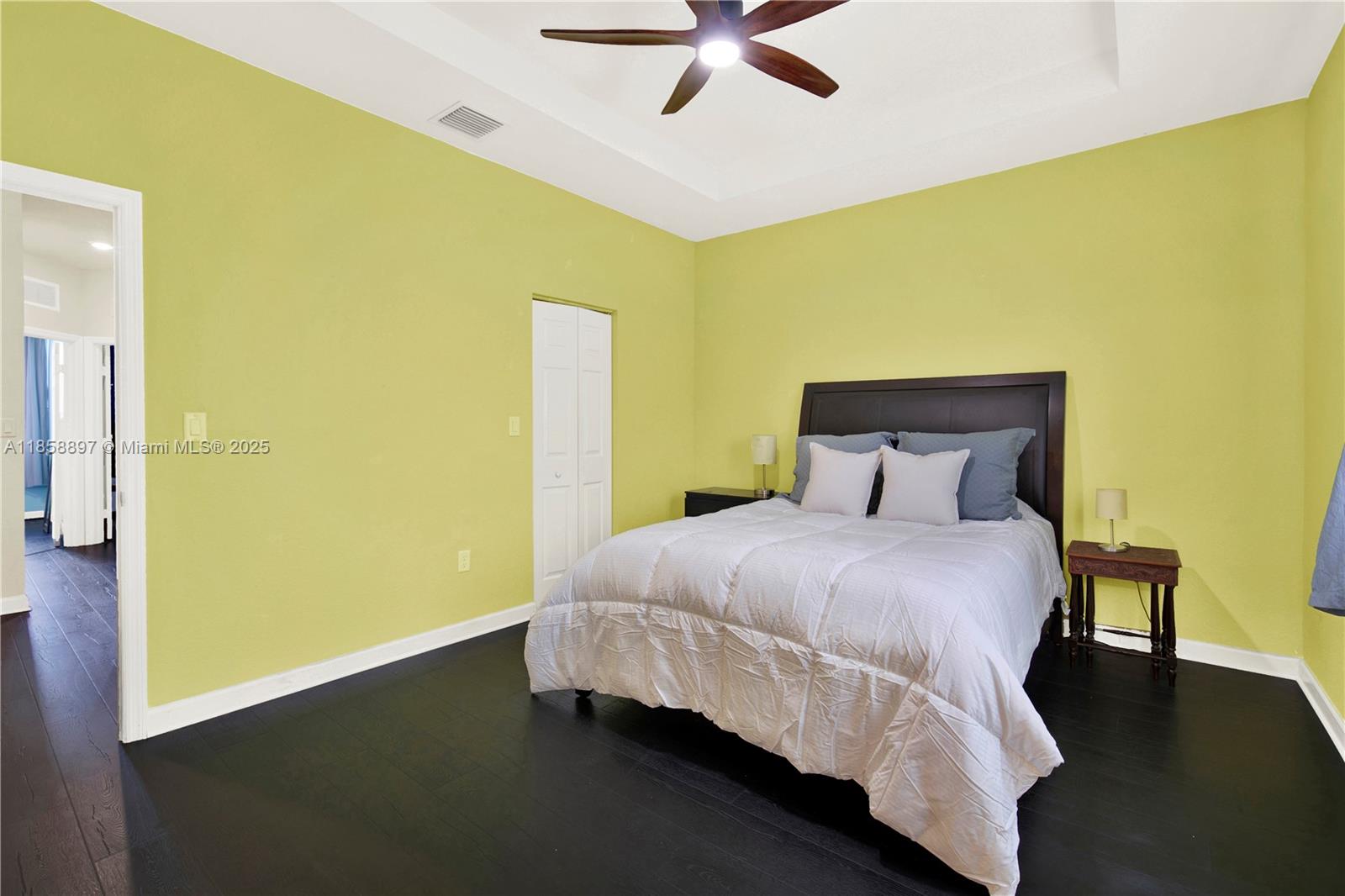 10480 West 33rd Lane Hialeah, FL 33018 - Photo 20 of 53 a bedroom with a bed and wooden floor