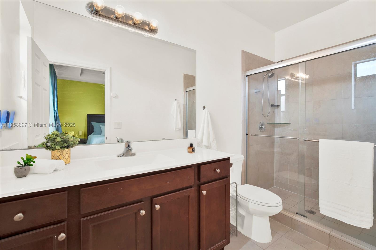 10480 West 33rd Lane Hialeah, FL 33018 - Photo 21 of 53 a bathroom with a sink a toilet and shower