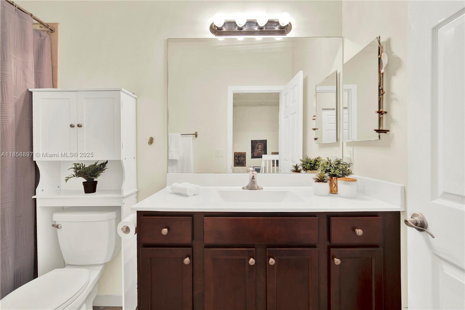10480 West 33rd Lane Hialeah, FL 33018 - Photo 27 of 53 a bathroom with a sink vanity granite and toilet