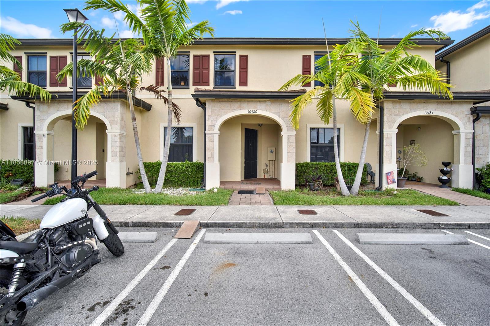 10480 West 33rd Lane Hialeah, FL 33018 - Photo 3 of 53 a front view of a house with garden