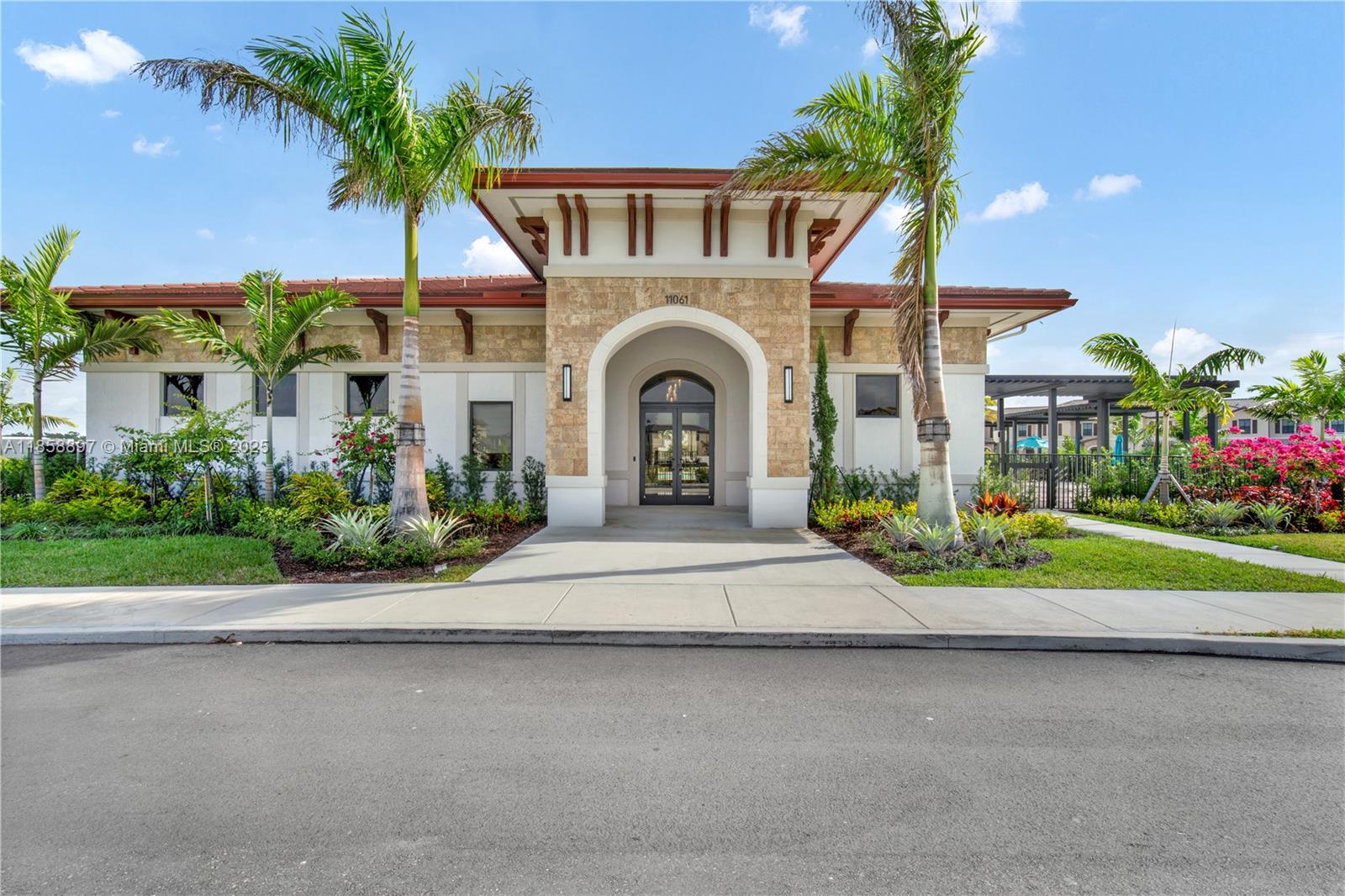 10480 West 33rd Lane Hialeah, FL 33018 - Photo 40 of 53 a front view of a house with a garden and trees
