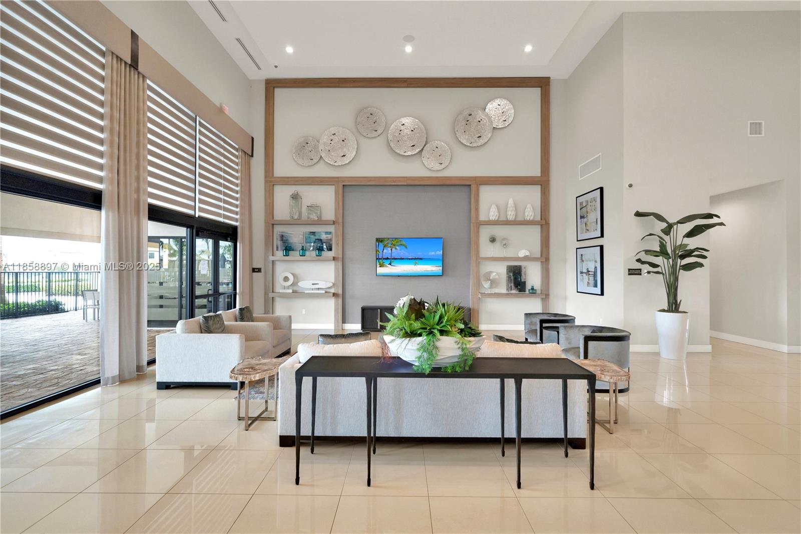 10480 West 33rd Lane Hialeah, FL 33018 - Photo 49 of 53 a living room with furniture and a large window
