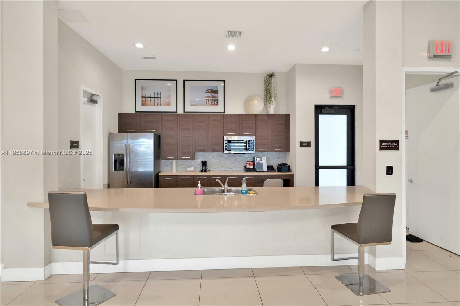 10480 West 33rd Lane Hialeah, FL 33018 - Photo 51 of 53 a living room with stainless steel appliances kitchen island granite countertop furniture and a refrigerator