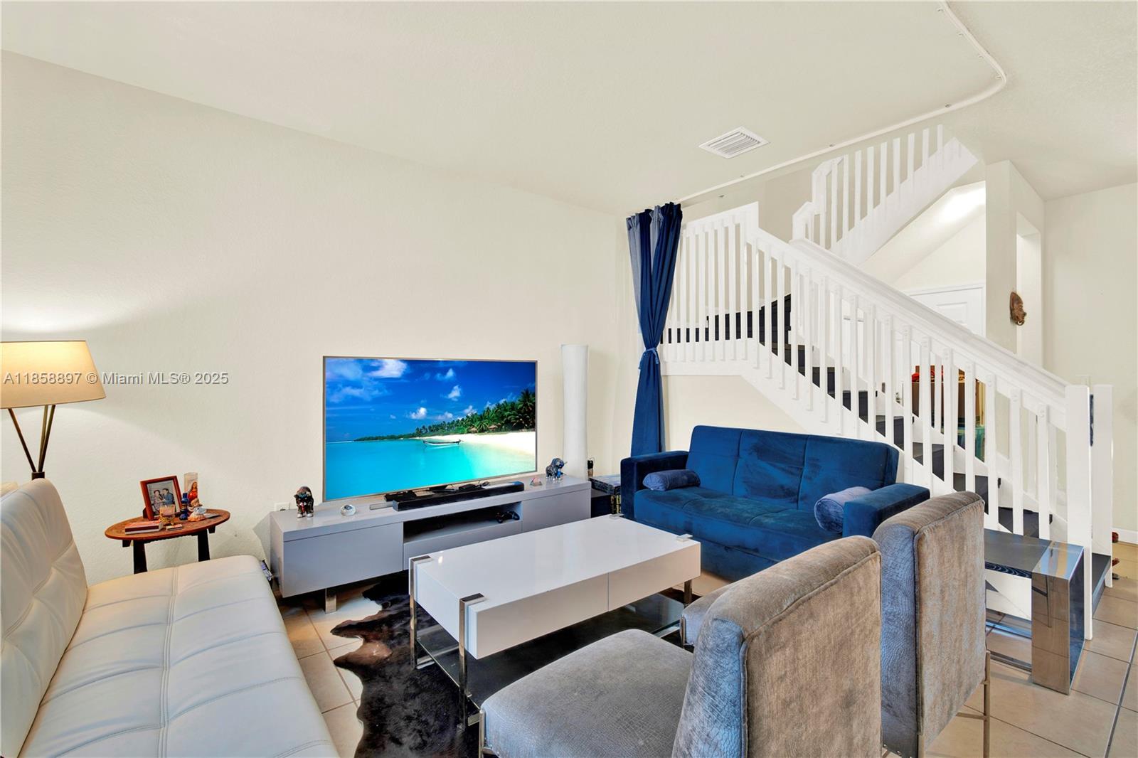 10480 West 33rd Lane Hialeah, FL 33018 - Photo 7 of 53 a living room with furniture and a flat screen tv