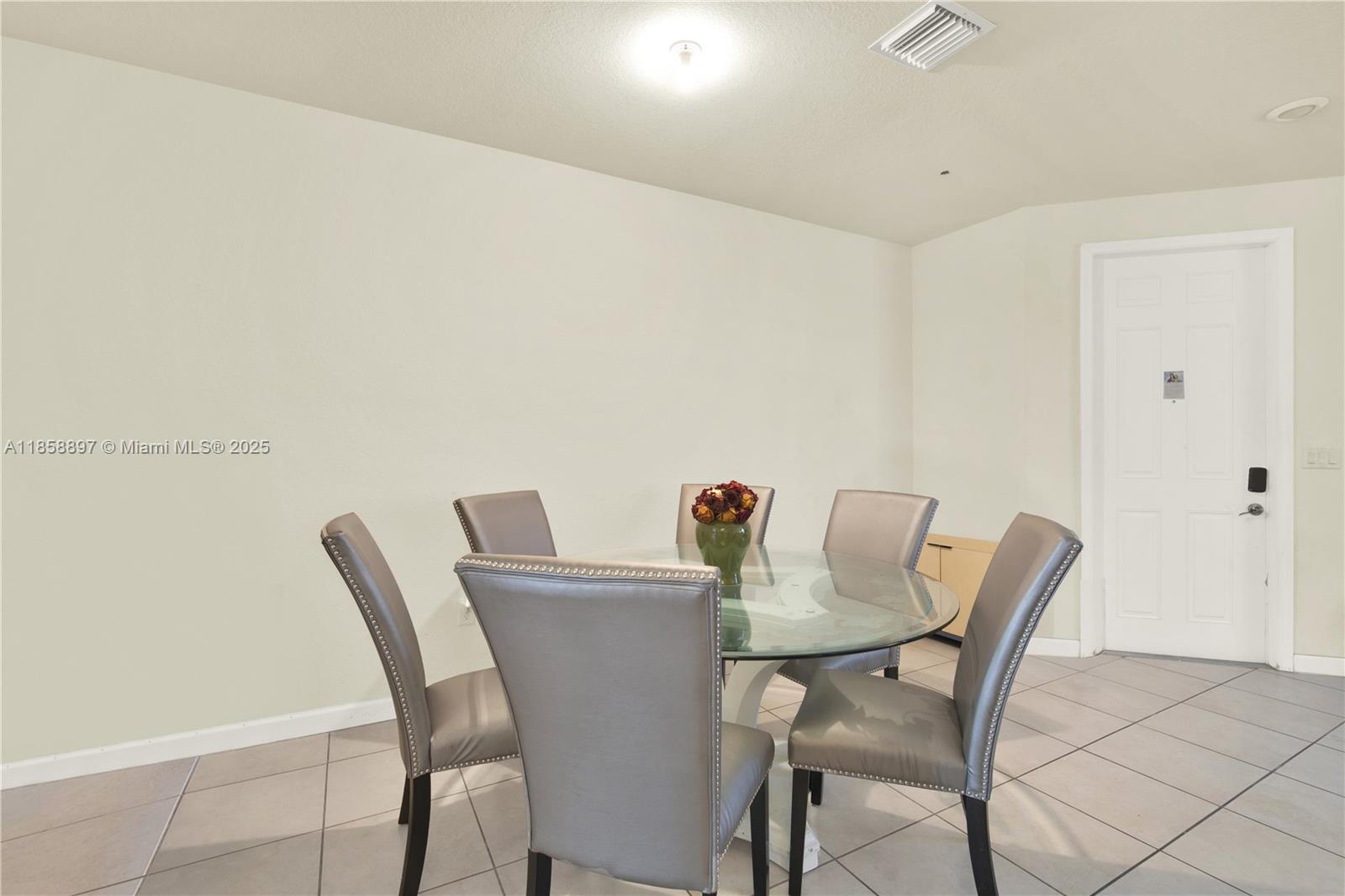 10480 West 33rd Lane Hialeah, FL 33018 - Photo 10 of 53 a view of a dining room with furniture