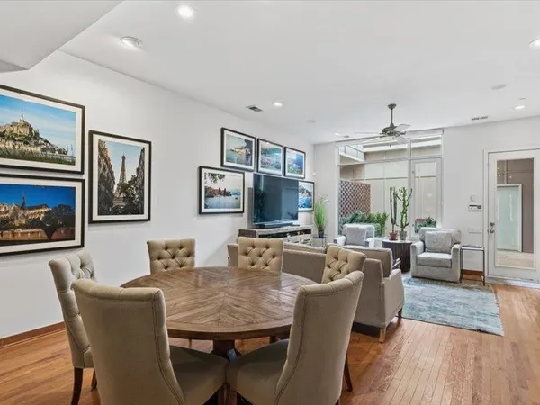 a view of a dining room with furniture window and wooden floor
