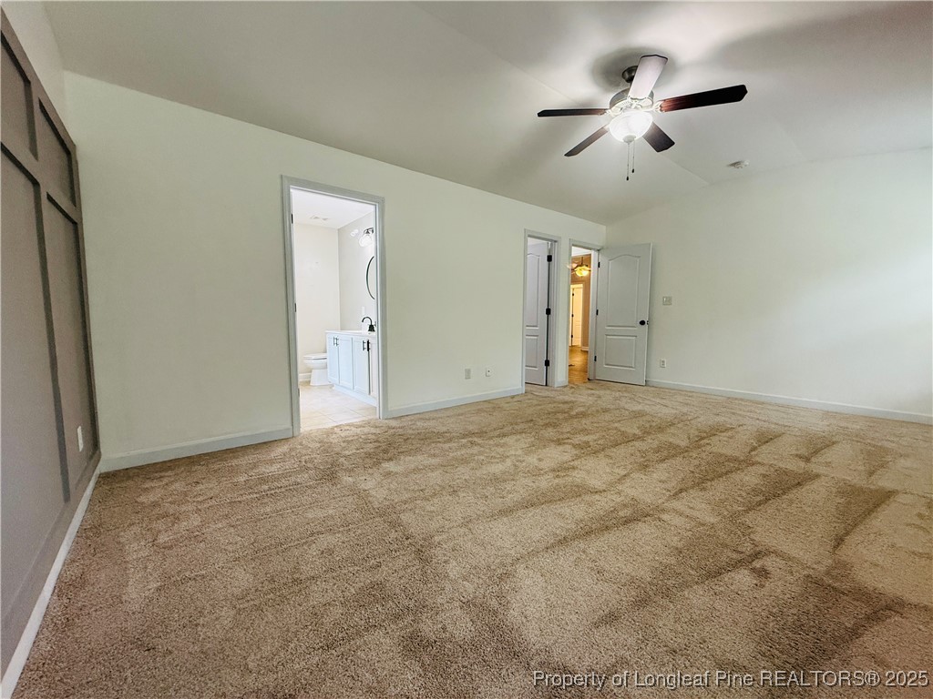 193 Bayleaf Drive Raeford, NC 28376 - Photo 12 of 25 an empty room with closet and a ceiling fan