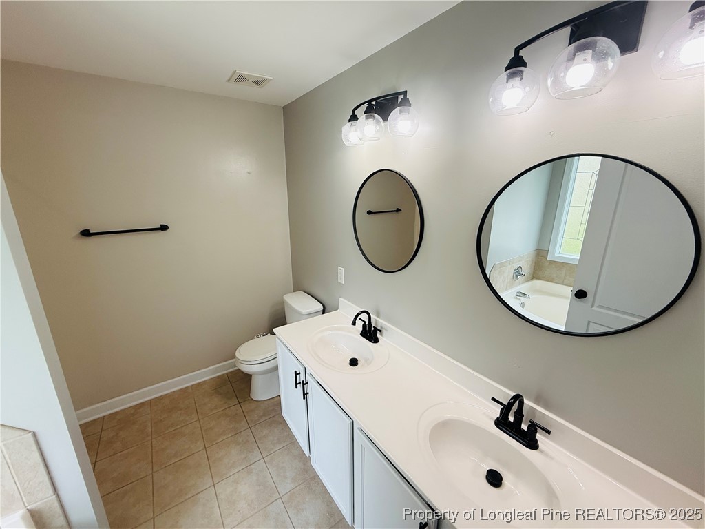 193 Bayleaf Drive Raeford, NC 28376 - Photo 14 of 25 a bathroom with a sink and a mirror