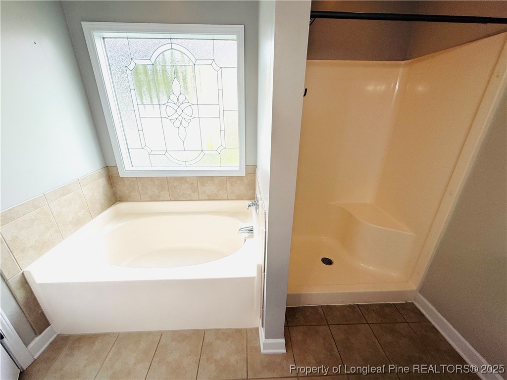 193 Bayleaf Drive Raeford, NC 28376 - Photo 15 of 25 a bathroom with a bathtub