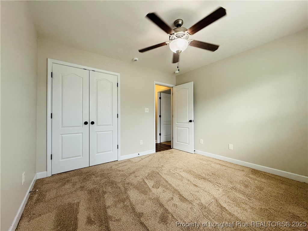 193 Bayleaf Drive Raeford, NC 28376 - Photo 19 of 25 an empty room with fan and a ceiling fan