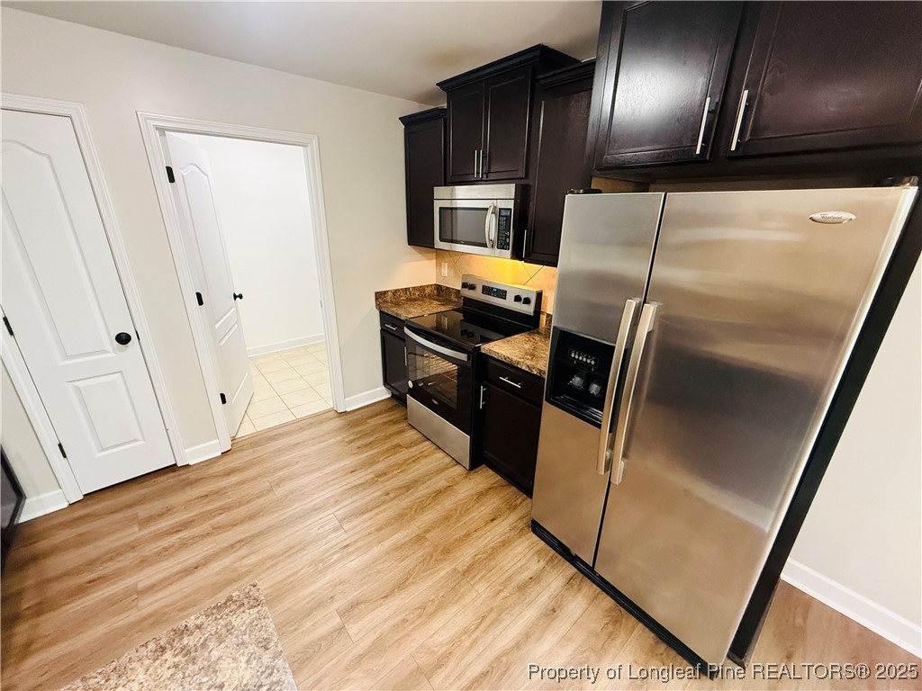 193 Bayleaf Drive Raeford, NC 28376 - Photo 8 of 25 a kitchen with granite countertop stainless steel appliances counter space and a window