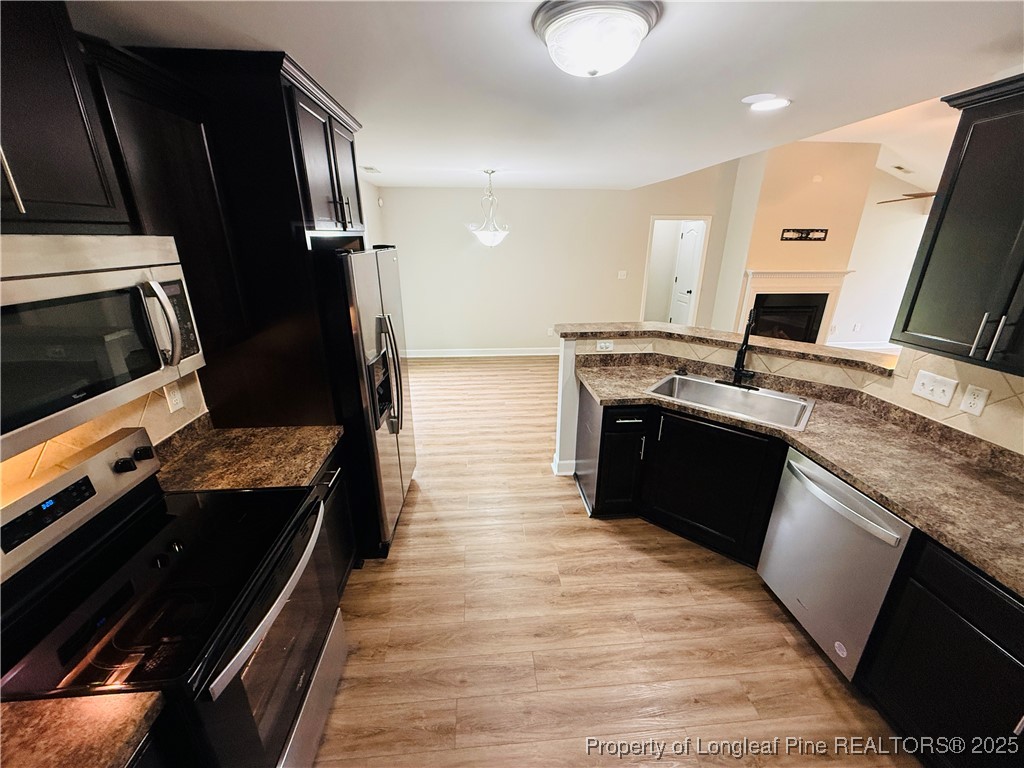 193 Bayleaf Drive Raeford, NC 28376 - Photo 9 of 25 a large kitchen with a stove and a refrigerator