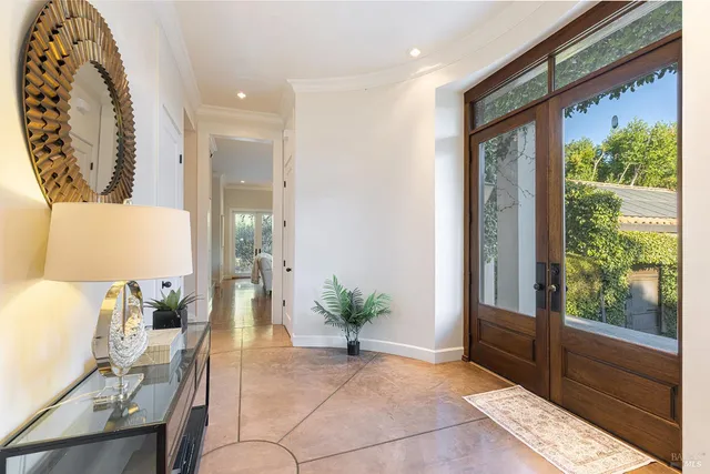 a view of a patio with table and chairs and potted plants