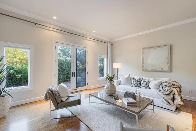 a view of backyard with outdoor seating and green space