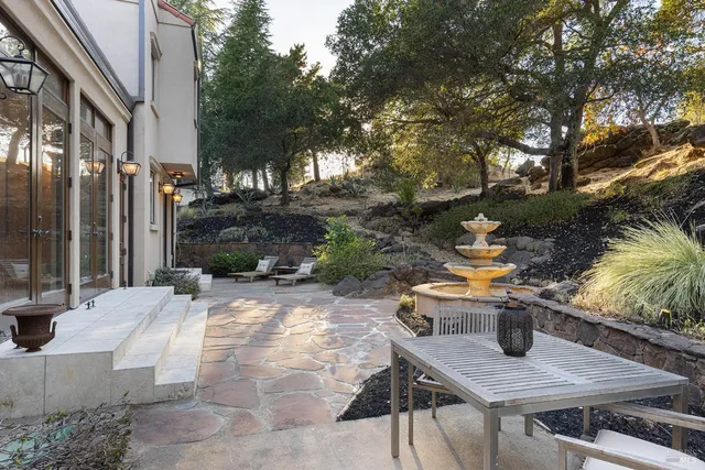 a bathroom with a granite countertop sink a mirror and a shower
